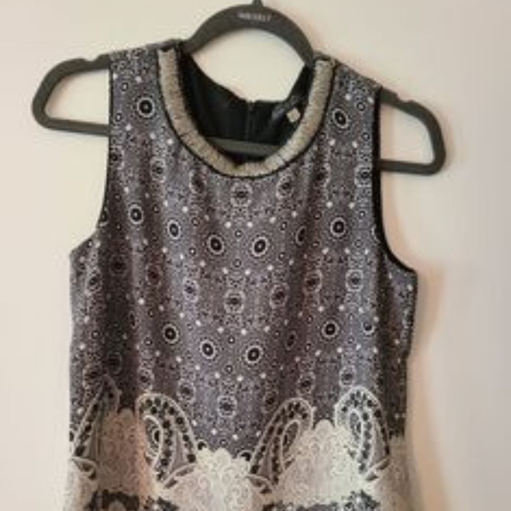 Rose and Olive black and white top. Size small. Has beaded detail.